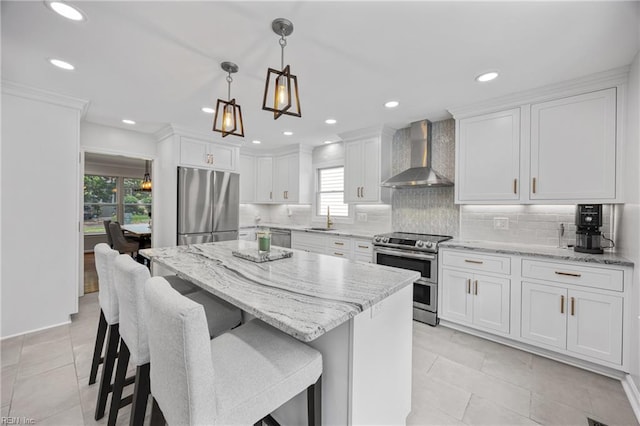 929 Magnolia Ave, Norfolk, VA 23508 - kitchen featuring wall chimney exhaust hood, stainless steel appliances, plenty of natural light, backsplash, and recessed lighting
