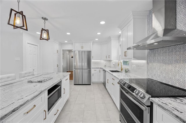 929 Magnolia Ave, Norfolk, VA 23508 - kitchen featuring appliances with stainless steel finishes, wall chimney exhaust hood, recessed lighting, and white cabinetry