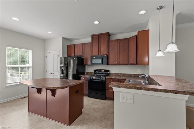 619 Muddy Creek Rd, Chesapeake, VA 23324 - kitchen featuring black appliances, dark countertops, a peninsula, and recessed lighting
