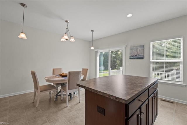 619 Muddy Creek Rd, Chesapeake, VA 23324 - kitchen with dark countertops, dark brown cabinets, pendant lighting, recessed lighting, and a center island