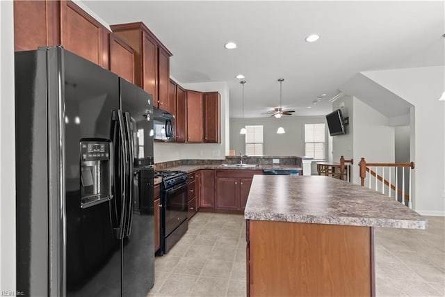 619 Muddy Creek Rd, Chesapeake, VA 23324 - kitchen featuring black appliances, ceiling fan, light tile patterned flooring, a center island, and recessed lighting