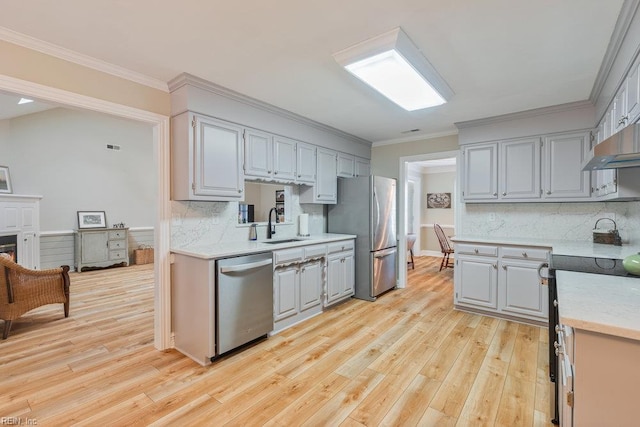 633 Aguila Dr, Chesapeake, VA 23322 - kitchen with appliances with stainless steel finishes, light countertops, light wood-style flooring, gray cabinetry, and tasteful backsplash