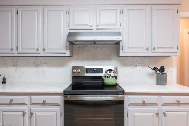 633 Aguila Dr, Chesapeake, VA 23322 - kitchen with electric range, exhaust hood, tasteful backsplash, and white cabinetry