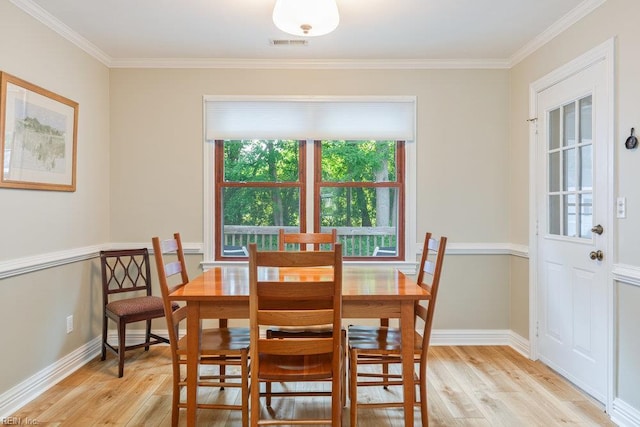 633 Aguila Dr, Chesapeake, VA 23322 - dining room with light wood finished floors and ornamental molding