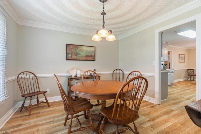 633 Aguila Dr, Chesapeake, VA 23322 - dining room with light wood-type flooring, ornamental molding, and a chandelier
