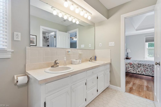 633 Aguila Dr, Chesapeake, VA 23322 - ensuite bathroom with double vanity, decorative backsplash, and tile patterned flooring