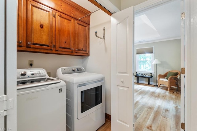 633 Aguila Dr, Chesapeake, VA 23322 - laundry room featuring cabinet space, independent washer and dryer, light wood-type flooring, and ornamental molding