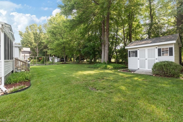 633 Aguila Dr, Chesapeake, VA 23322 - view of green lawn with an outbuilding