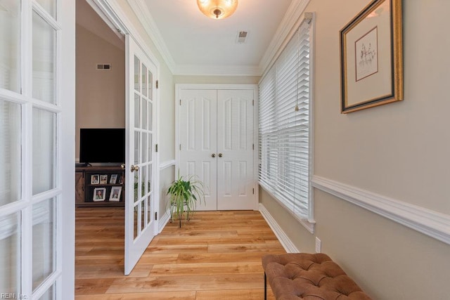 633 Aguila Dr, Chesapeake, VA 23322 - hall with french doors, light wood-style flooring, and crown molding