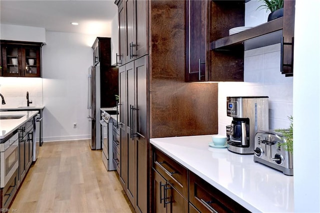 3 Menife Ct, Williamsburg, VA 23188 - kitchen with tasteful backsplash, dark brown cabinets, light countertops, and recessed lighting