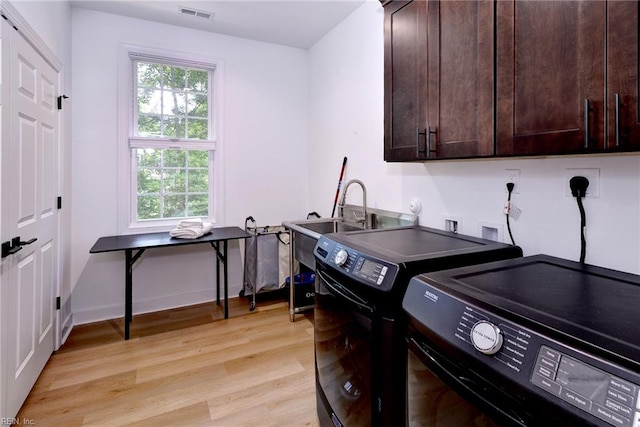3 Menife Ct, Williamsburg, VA 23188 - washroom featuring cabinet space, washer and clothes dryer, and light wood finished floors