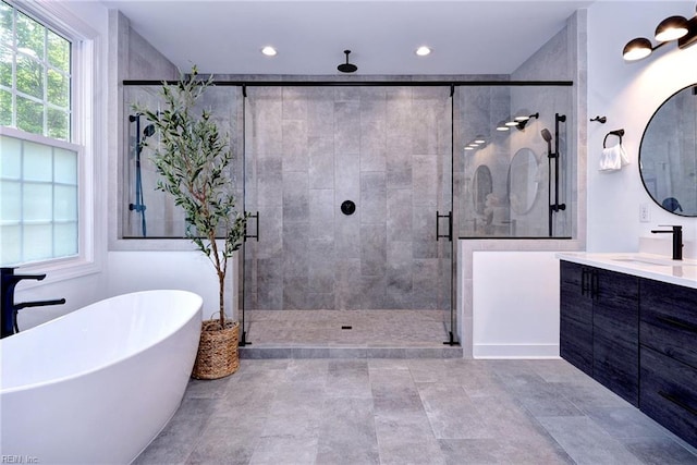 3 Menife Ct, Williamsburg, VA 23188 - full bath featuring vanity, a soaking tub, a stall shower, and recessed lighting