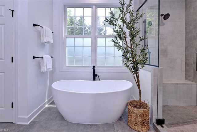 3 Menife Ct, Williamsburg, VA 23188 - full bath featuring a freestanding tub, a walk in shower, and tile patterned floors