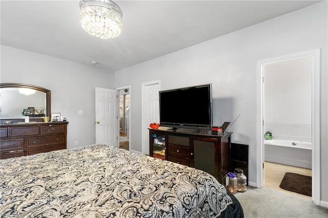 1058 Hillpoint Rd, Suffolk, VA 23434 - bedroom with carpet floors, a chandelier, and ensuite bathroom