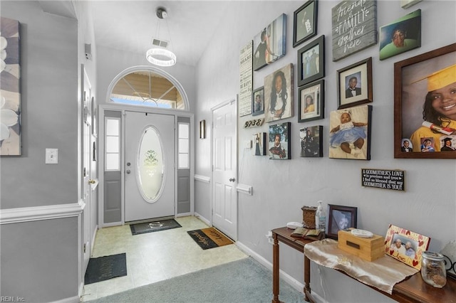 1058 Hillpoint Rd, Suffolk, VA 23434 - foyer entrance featuring tile patterned floors and a towering ceiling