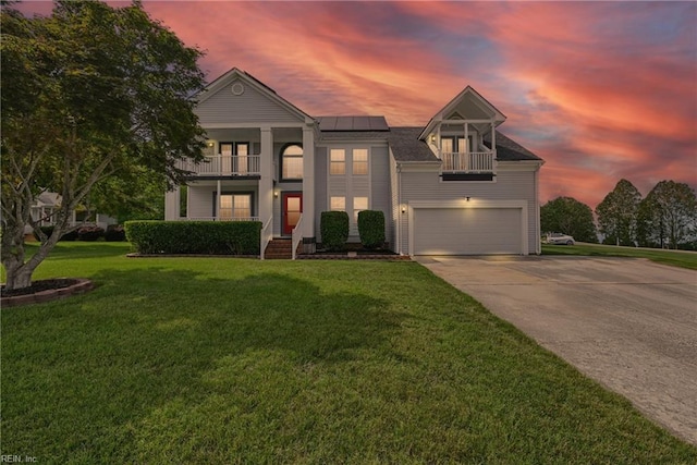 700 Hilltop Ct, Chesapeake, VA 23322 - greek revival inspired property featuring a balcony, solar panels, driveway, and an attached garage