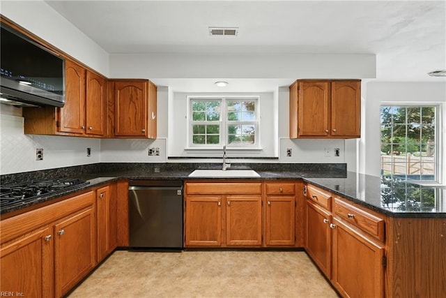 700 Hilltop Ct, Chesapeake, VA 23322 - kitchen featuring stainless steel appliances, healthy amount of natural light, a peninsula, and dark stone counters