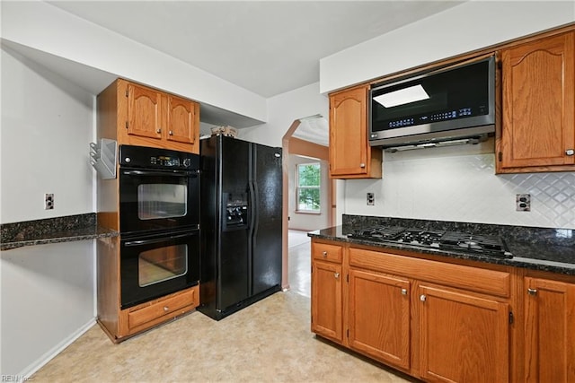 700 Hilltop Ct, Chesapeake, VA 23322 - kitchen featuring black appliances, dark stone countertops, backsplash, and brown cabinetry