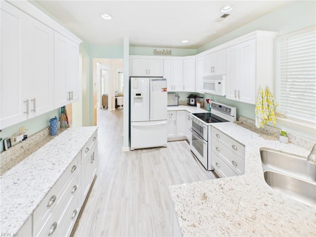 2909 Drum Point Cres, Chesapeake, VA 23321 - kitchen featuring white appliances, white cabinetry, light wood-type flooring, light stone counters, and recessed lighting
