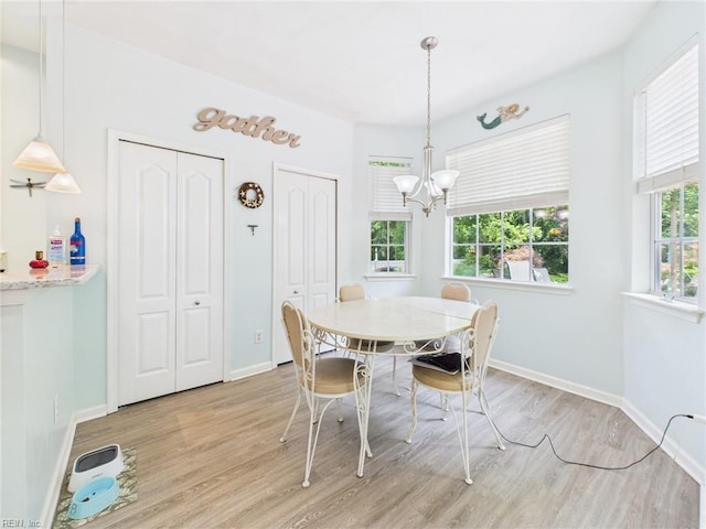 2909 Drum Point Cres, Chesapeake, VA 23321 - dining area with light wood finished floors and a chandelier