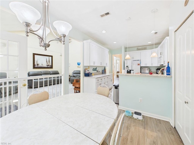 2909 Drum Point Cres, Chesapeake, VA 23321 - dining space featuring light wood-type flooring, a chandelier, and recessed lighting
