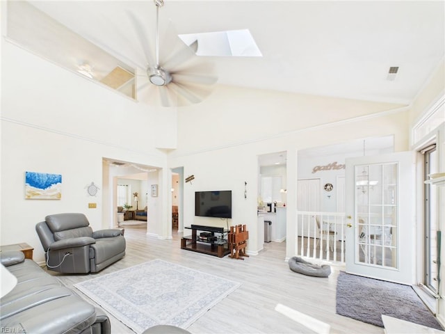 2909 Drum Point Cres, Chesapeake, VA 23321 - living room featuring wood finished floors, a skylight, lofted ceiling, and a ceiling fan