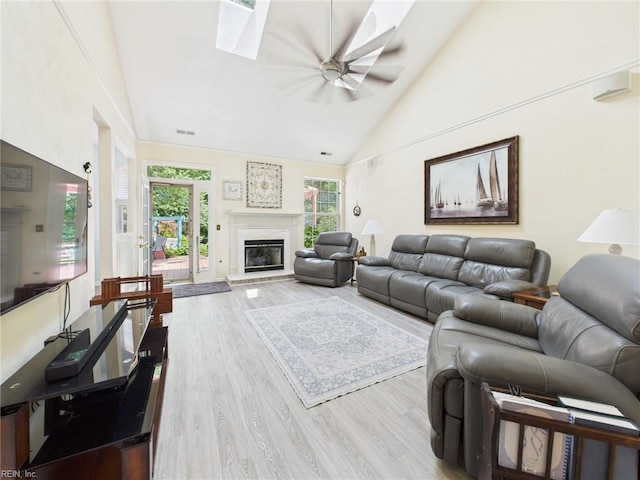 2909 Drum Point Cres, Chesapeake, VA 23321 - living area featuring wood finished floors, high vaulted ceiling, a ceiling fan, plenty of natural light, and a glass covered fireplace
