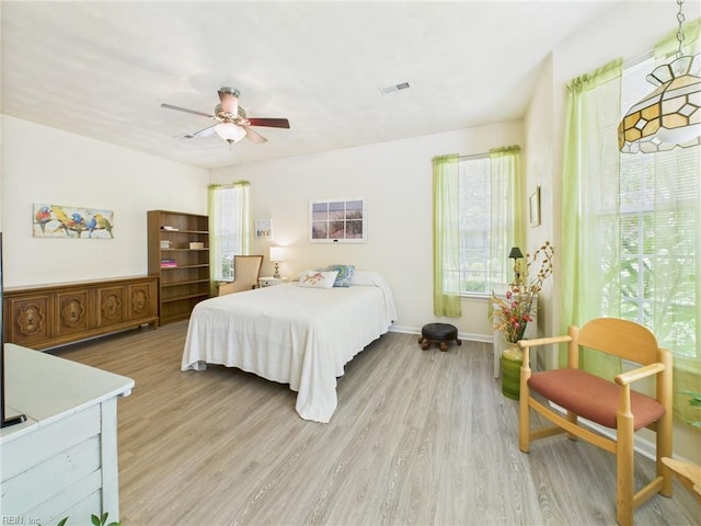 2909 Drum Point Cres, Chesapeake, VA 23321 - bedroom featuring light wood-type flooring, multiple windows, and a ceiling fan