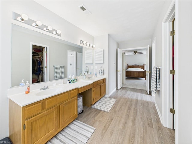2909 Drum Point Cres, Chesapeake, VA 23321 - full bath featuring wood finished floors, double vanity, ensuite bathroom, ceiling fan, and a walk in closet