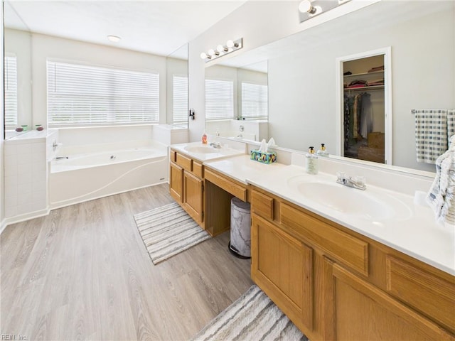 2909 Drum Point Cres, Chesapeake, VA 23321 - full bathroom featuring double vanity, wood finished floors, a bath, and a walk in closet