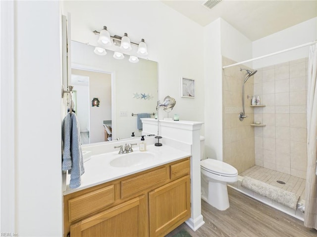 2909 Drum Point Cres, Chesapeake, VA 23321 - bathroom featuring vanity, wood finished floors, and a tile shower