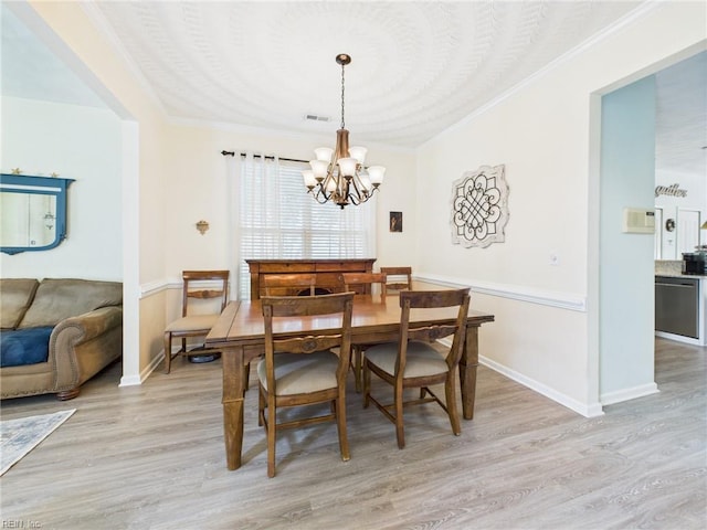 2909 Drum Point Cres, Chesapeake, VA 23321 - dining room with a chandelier, light wood finished floors, and ornamental molding