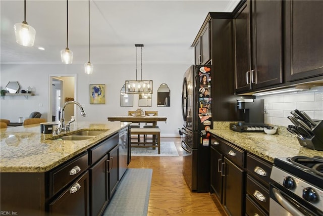 3216 Meanley Dr, Chesapeake, VA 23323 - kitchen with appliances with stainless steel finishes, tasteful backsplash, ornamental molding, light wood-style floors, and dark brown cabinetry
