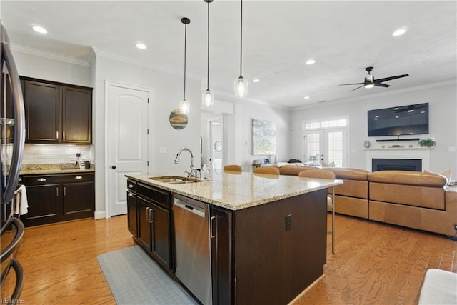 3216 Meanley Dr, Chesapeake, VA 23323 - kitchen with stainless steel appliances, a breakfast bar area, a ceiling fan, dark brown cabinets, and light wood finished floors