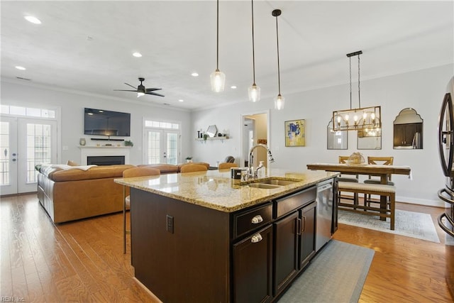 3216 Meanley Dr, Chesapeake, VA 23323 - kitchen featuring ornamental molding, stainless steel dishwasher, a breakfast bar area, a ceiling fan, and wood finished floors