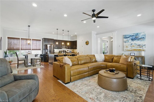 3216 Meanley Dr, Chesapeake, VA 23323 - living room featuring wood finished floors, ceiling fan, crown molding, and recessed lighting