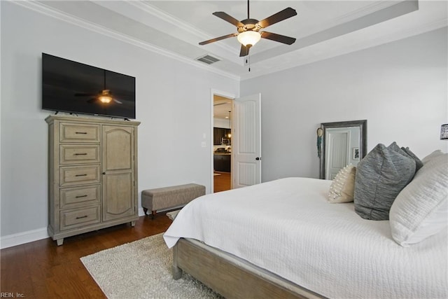 3216 Meanley Dr, Chesapeake, VA 23323 - bedroom featuring a tray ceiling, ornamental molding, dark wood-style flooring, and a ceiling fan