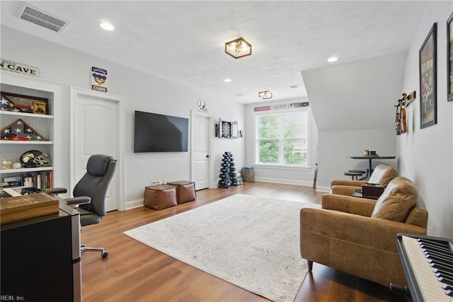 3216 Meanley Dr, Chesapeake, VA 23323 - living area featuring a desk, wood finished floors, and recessed lighting