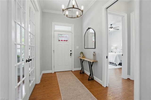 3216 Meanley Dr, Chesapeake, VA 23323 - foyer featuring french doors, ornamental molding, a chandelier, wood finished floors, and a ceiling fan