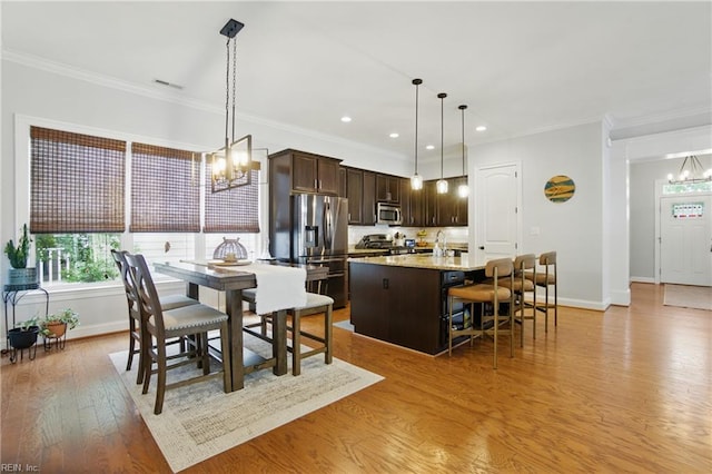 3216 Meanley Dr, Chesapeake, VA 23323 - dining room with a chandelier, light wood-style floors, ornamental molding, and recessed lighting
