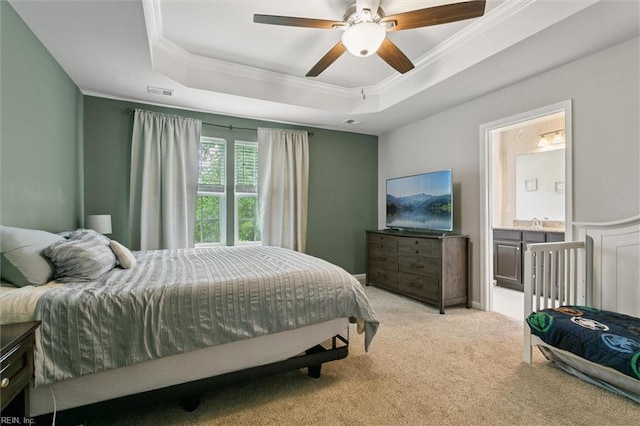 112 Mccormick Pl, Williamsburg, VA 23185 - bedroom featuring a tray ceiling, ornamental molding, light colored carpet, ensuite bath, and a ceiling fan