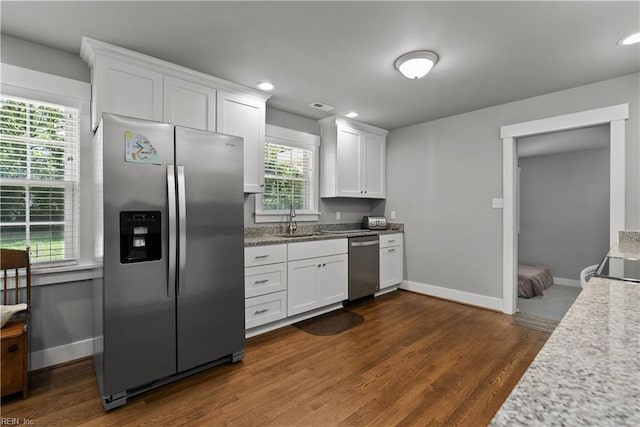 2309 Drum Creek Rd, Chesapeake, VA 23321 - kitchen featuring appliances with stainless steel finishes, white cabinets, dark wood-style floors, light stone counters, and recessed lighting