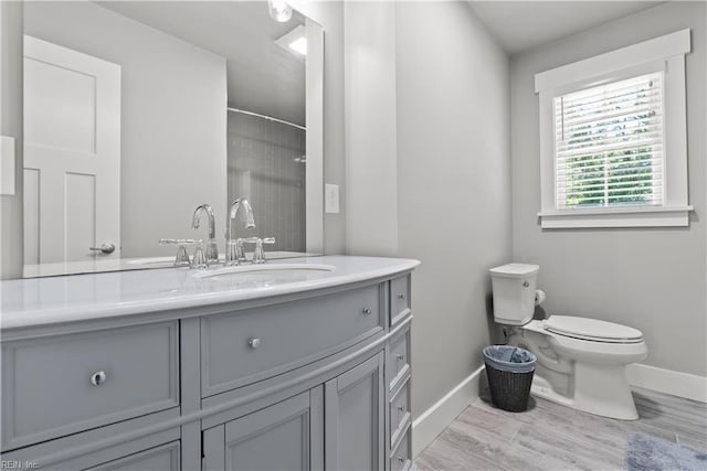 2309 Drum Creek Rd, Chesapeake, VA 23321 - bathroom with vanity, a shower, and wood finished floors