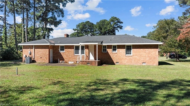 2309 Drum Creek Rd, Chesapeake, VA 23321 - back of property featuring a lawn, brick siding, and a chimney