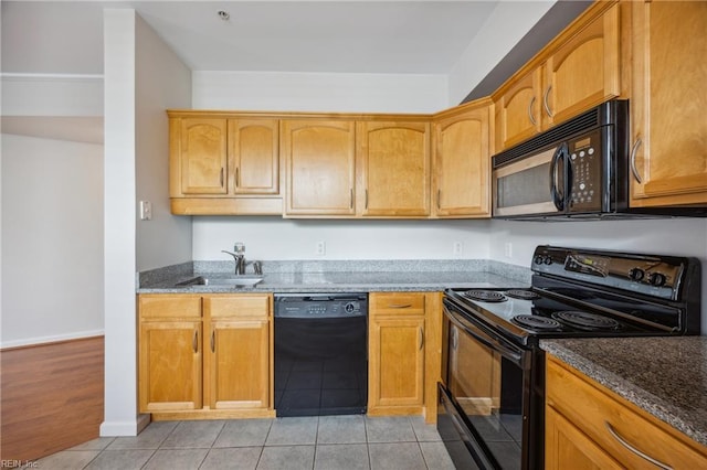 249 W Freemason St Unit 408, Norfolk, VA 23510 - kitchen featuring black appliances, dark stone counters, and light tile patterned floors
