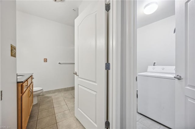 249 W Freemason St Unit 408, Norfolk, VA 23510 - bathroom with washer / clothes dryer, vanity, and tile patterned flooring