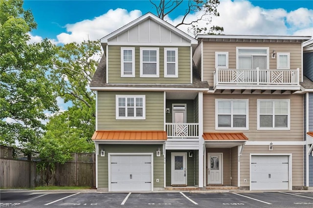 616 Foster Ln, Virginia Beach, VA 23451 - multi unit property featuring board and batten siding, a standing seam roof, a garage, a metal roof, and uncovered parking