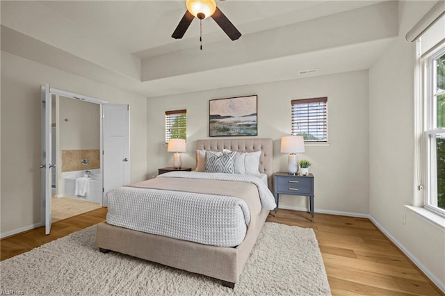 616 Foster Ln, Virginia Beach, VA 23451 - bedroom with a raised ceiling, wood finished floors, and a ceiling fan