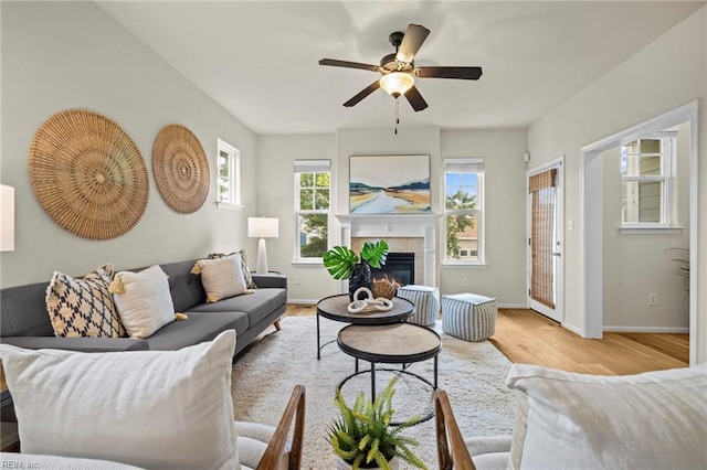 616 Foster Ln, Virginia Beach, VA 23451 - living room with light wood-type flooring, a ceiling fan, and a tiled fireplace
