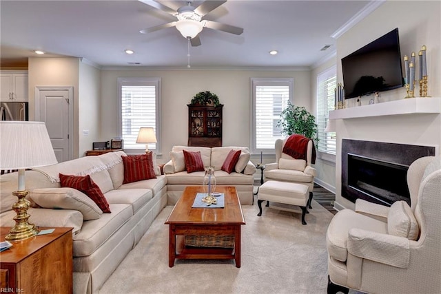 3998 Isaac Cir, Williamsburg, VA 23188 - living room with healthy amount of natural light, a fireplace, a ceiling fan, recessed lighting, and crown molding